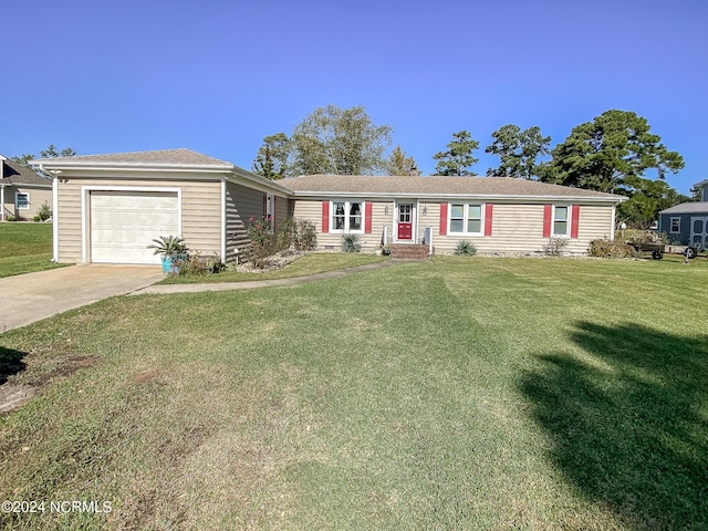 single story home featuring entry steps, concrete driveway, a garage, and a front yard