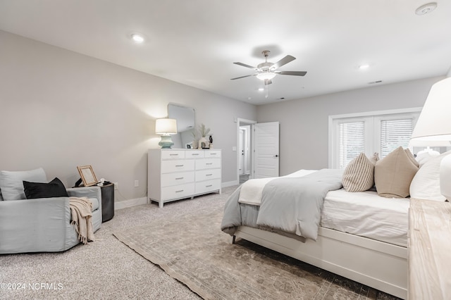 carpeted bedroom featuring visible vents, recessed lighting, a ceiling fan, and baseboards