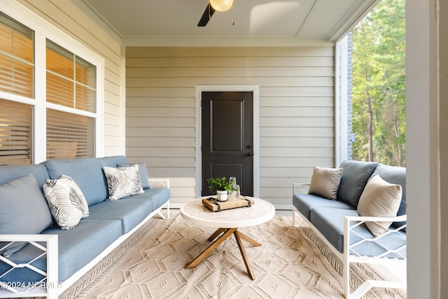 sunroom featuring ceiling fan