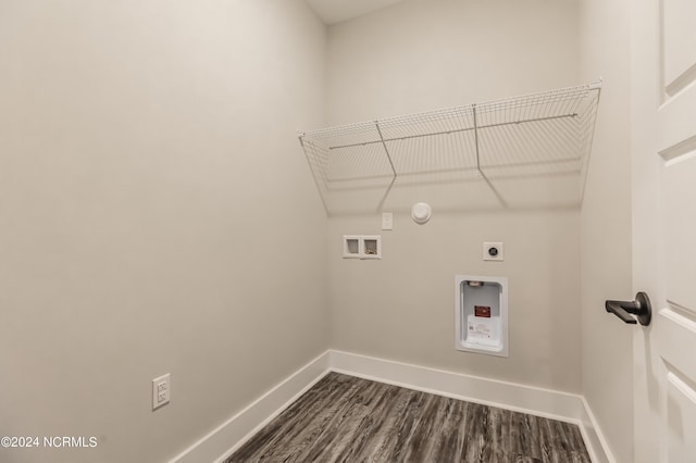 clothes washing area with dark wood-type flooring, baseboards, laundry area, hookup for a washing machine, and hookup for an electric dryer