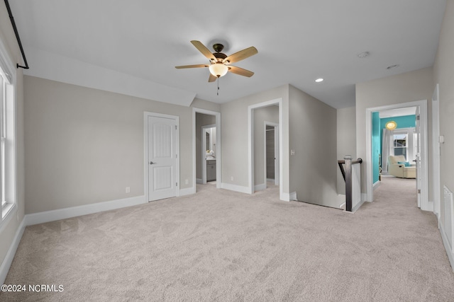 spare room with recessed lighting, light colored carpet, baseboards, and ceiling fan