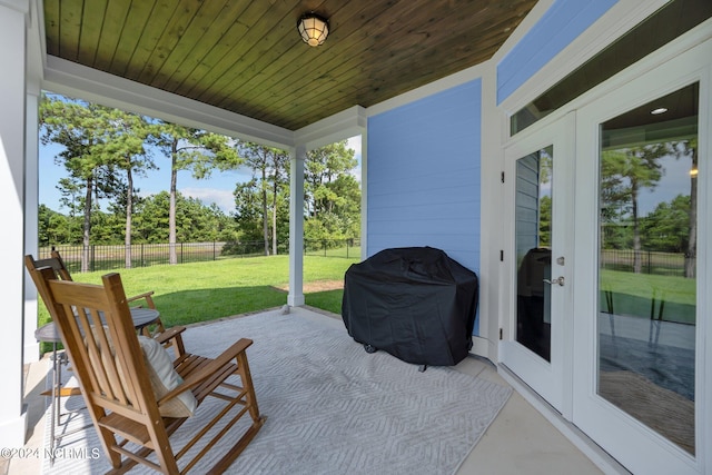 view of patio with area for grilling and a fenced backyard