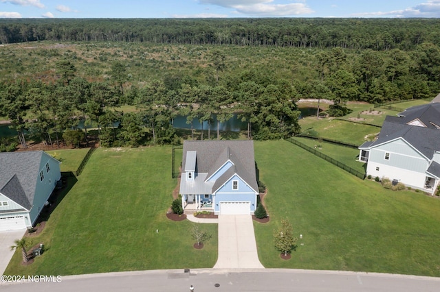 drone / aerial view featuring a view of trees