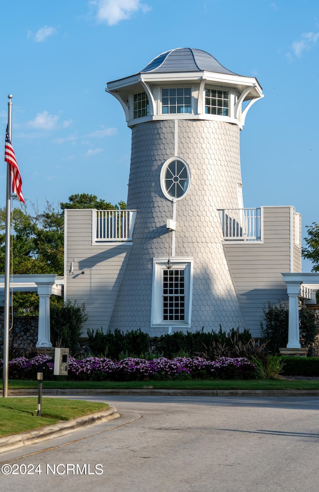 view of home's exterior with a balcony