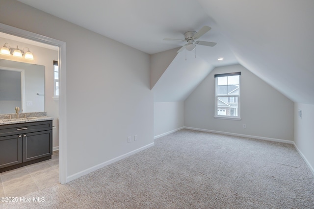 7053 Trailhead Rd, Leland, NC 28451 - additional living space with a sink, ceiling fan, light carpet, and vaulted ceiling