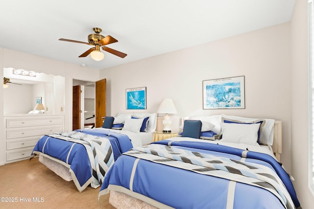 bedroom featuring light carpet and ceiling fan