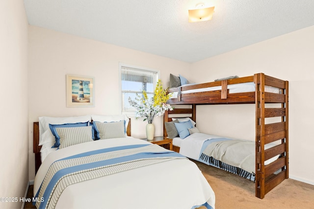 carpeted bedroom with a textured ceiling