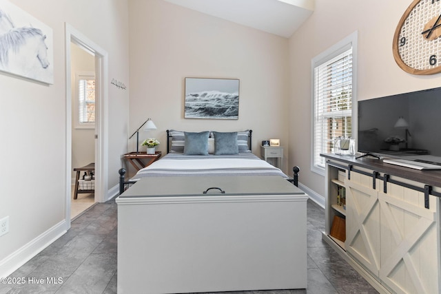 bedroom with multiple windows and baseboards