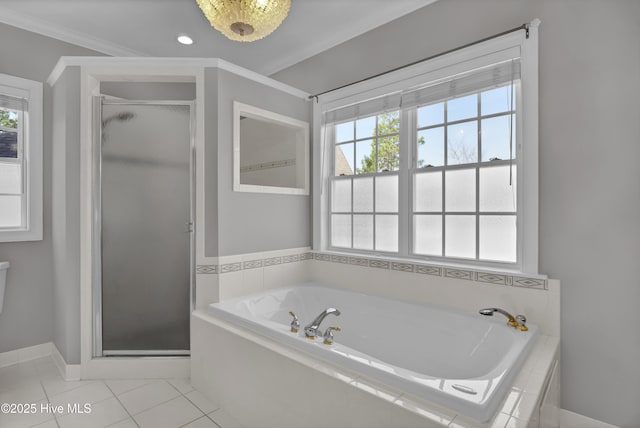 full bath featuring tile patterned floors, a stall shower, a bath, and crown molding