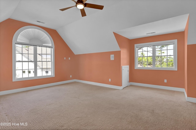 bonus room featuring visible vents, plenty of natural light, and lofted ceiling