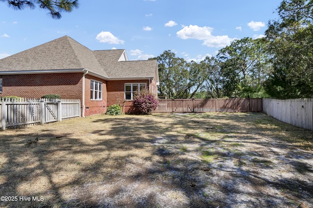 view of yard with a fenced backyard