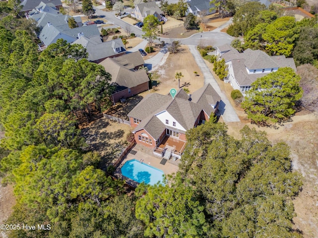 birds eye view of property with a residential view