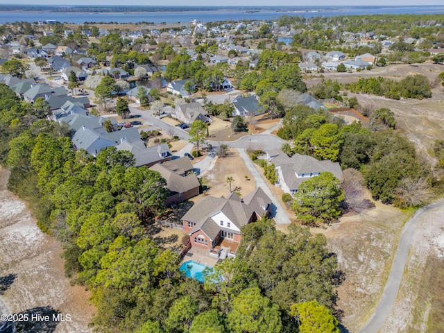 birds eye view of property with a residential view