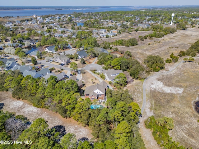 drone / aerial view with a residential view and a water view