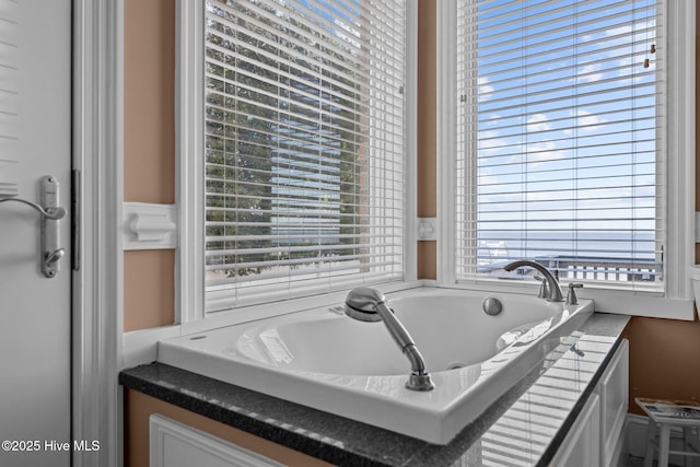 bathroom featuring a garden tub