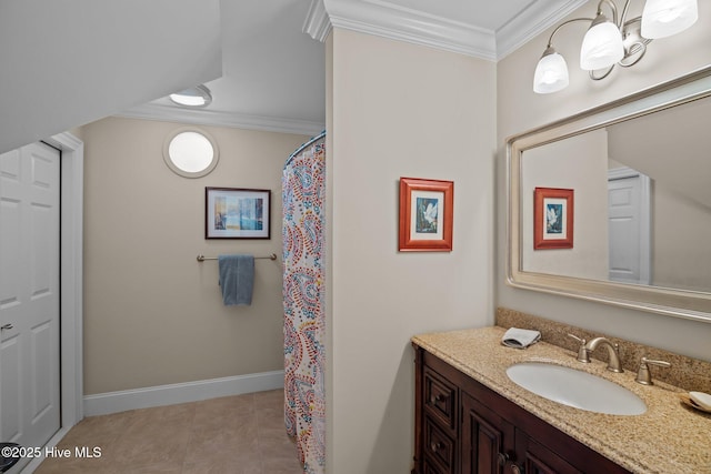 full bath featuring vanity, crown molding, and baseboards