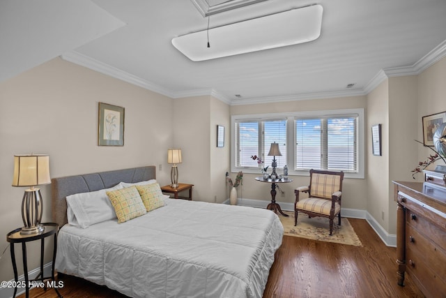 bedroom with attic access, crown molding, baseboards, and dark wood-style flooring