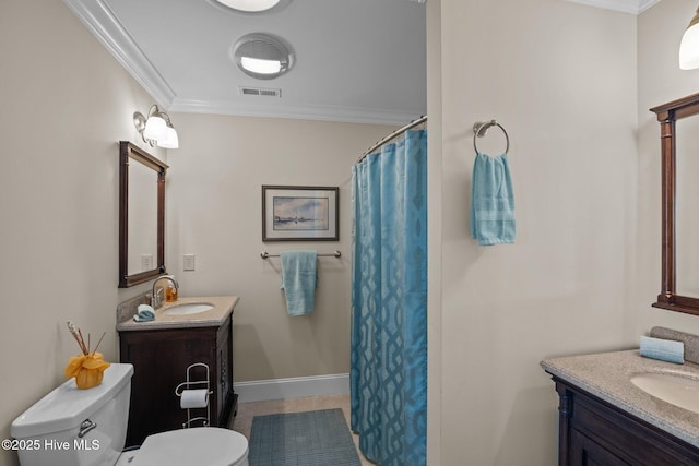 full bathroom featuring a sink, two vanities, and ornamental molding