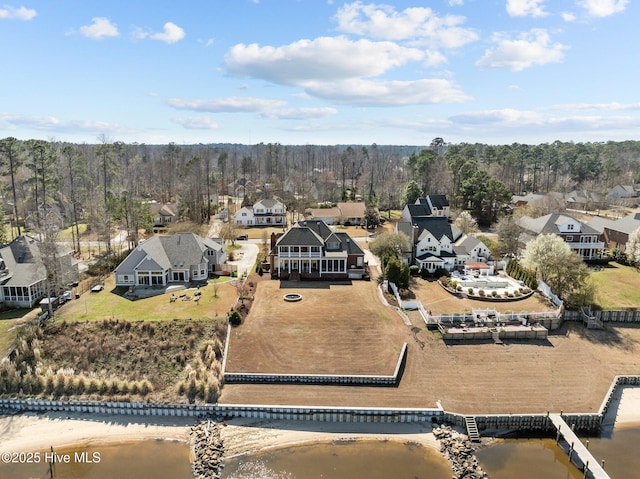 drone / aerial view with a residential view and a water view