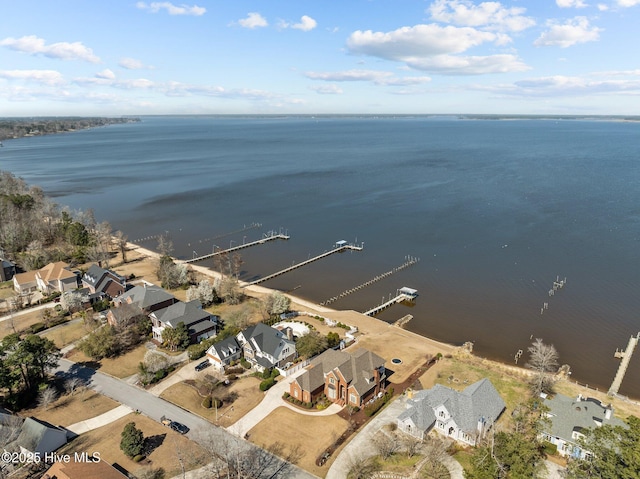 bird's eye view featuring a water view and a residential view