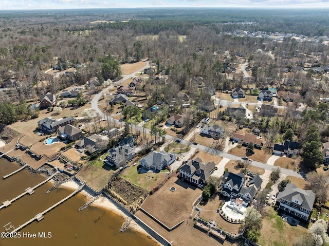 drone / aerial view featuring a residential view and a water view