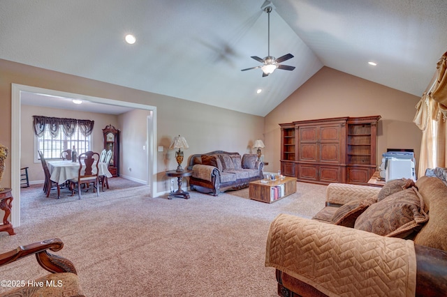 living area with recessed lighting, high vaulted ceiling, baseboards, and carpet floors