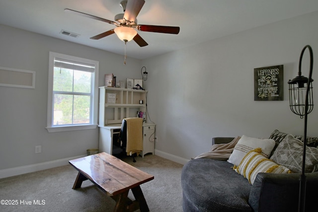 carpeted living area featuring visible vents, a ceiling fan, and baseboards