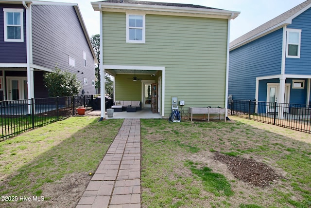 rear view of property with an outdoor living space, a patio, a fenced backyard, and a ceiling fan