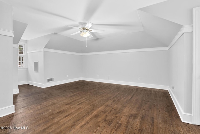 bonus room featuring a ceiling fan, vaulted ceiling, dark wood-style floors, and visible vents