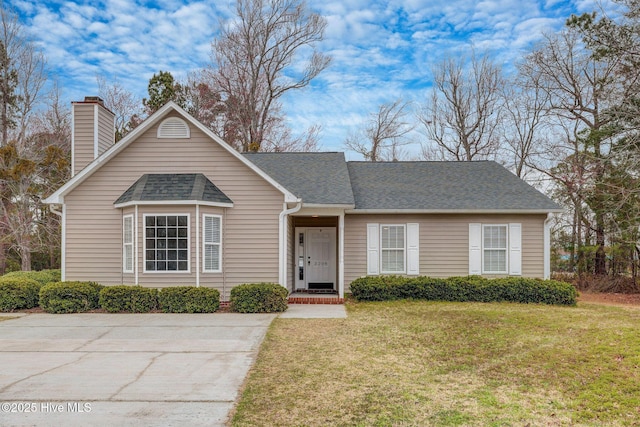 ranch-style home featuring a front lawn, a chimney, and a shingled roof