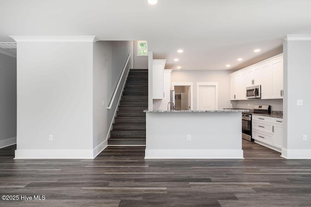 485 N Wild Rice Dr SW, Supply, NC 28462 - kitchen with recessed lighting, appliances with stainless steel finishes, baseboards, and dark wood-style flooring