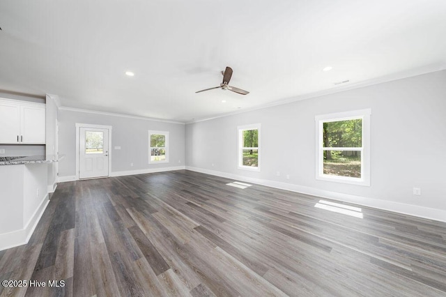 485 N Wild Rice Dr SW, Supply, NC 28462 - unfurnished living room with crown molding, baseboards, a ceiling fan, and dark wood-style floors