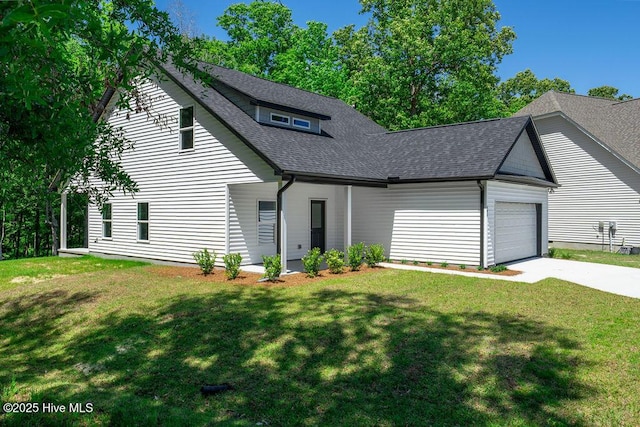 485 N Wild Rice Dr SW, Supply, NC 28462 - view of front of house with an attached garage, driveway, a shingled roof, and a front yard