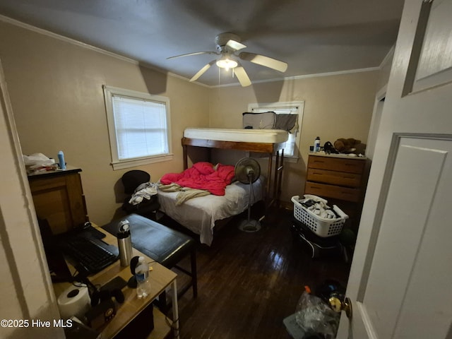 bedroom featuring crown molding, ceiling fan, and wood finished floors