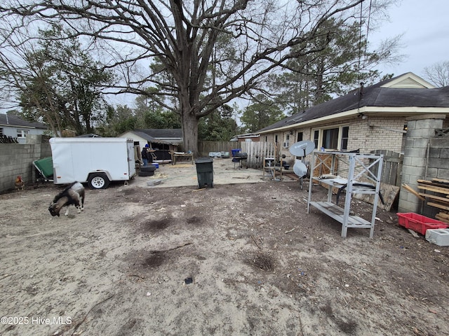 view of yard featuring fence and a wooden deck