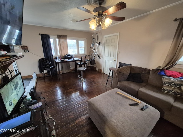 living area with ornamental molding, baseboards, ceiling fan, and hardwood / wood-style flooring