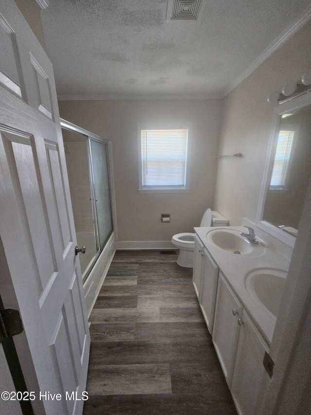 full bath with visible vents, a wealth of natural light, and a sink