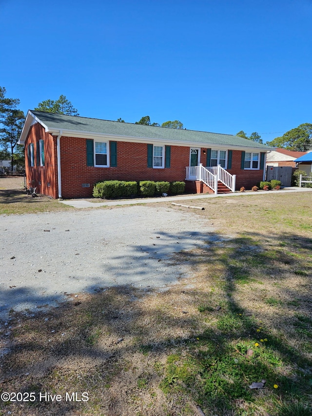 single story home with crawl space and brick siding