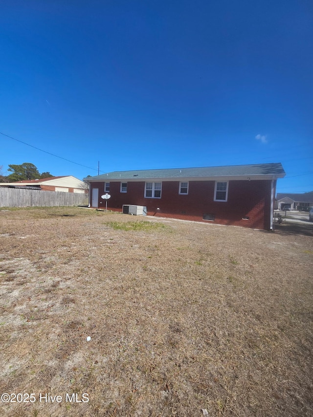 rear view of property with fence