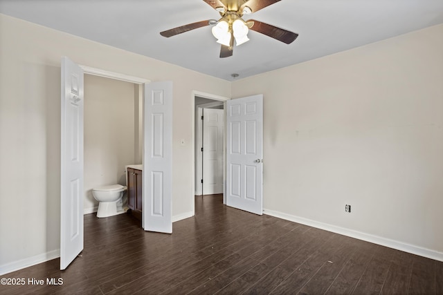 unfurnished bedroom featuring dark wood finished floors, baseboards, and ceiling fan