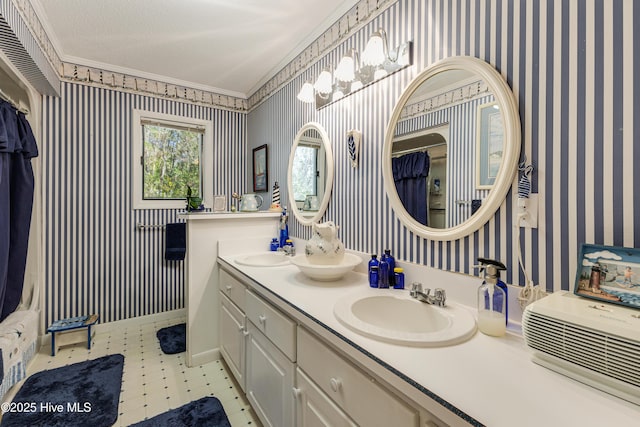 full bathroom featuring wallpapered walls, tile patterned floors, and a sink