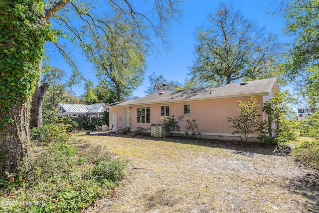 back of house featuring crawl space