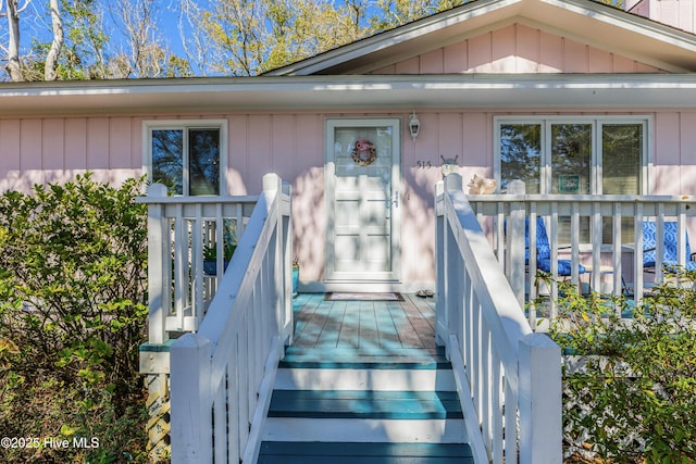 property entrance with board and batten siding