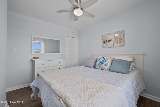 bedroom featuring a closet, ceiling fan, baseboards, and wood finished floors