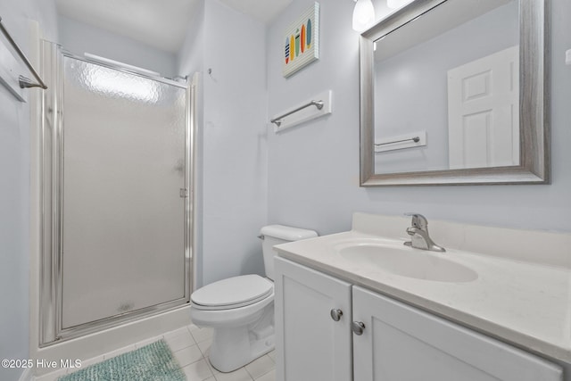 full bathroom with vanity, toilet, a shower stall, and tile patterned flooring