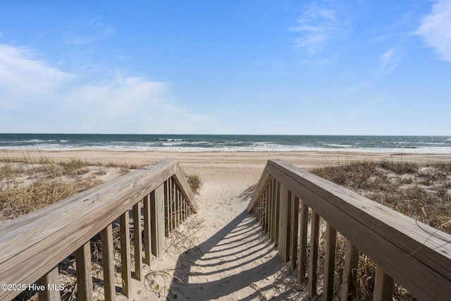 view of home's community with a view of the beach and a water view