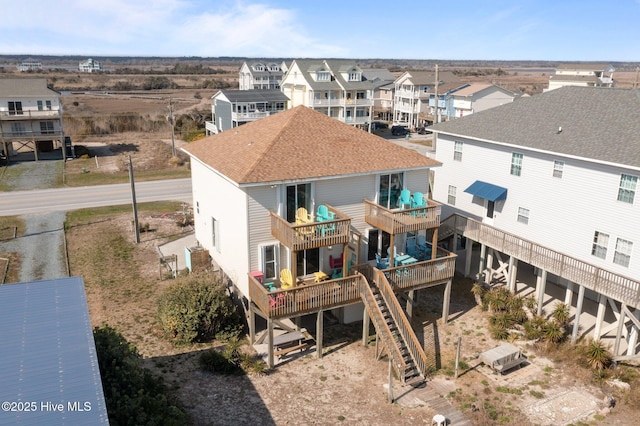 birds eye view of property with a residential view