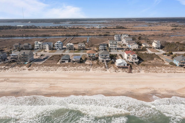 birds eye view of property with a residential view and a water view