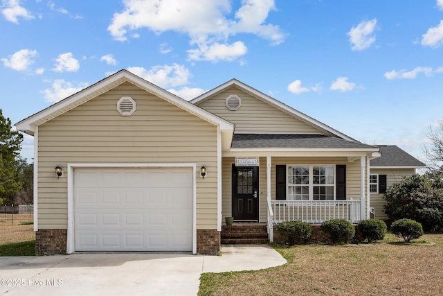 view of front of home featuring a porch, an attached garage, concrete driveway, and roof with shingles