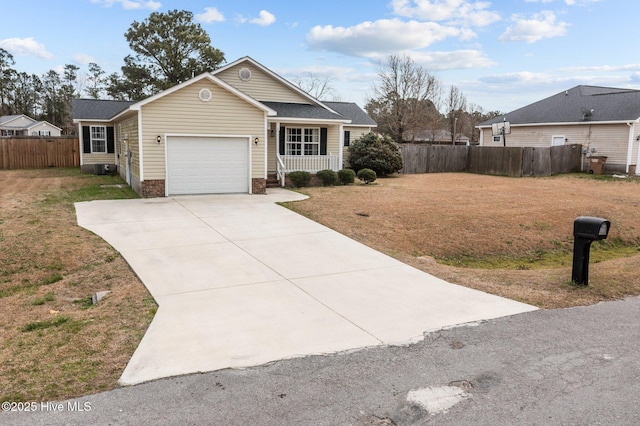 view of front of home featuring a porch, fence, concrete driveway, a front yard, and a garage